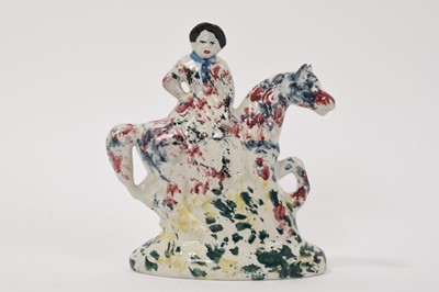Lot 47 - Staffordshire spongeware figure of a woman on horseback