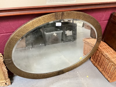 Lot 1505 - Early 20th century hammered brass framed oval mirror