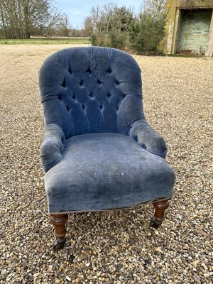 Lot 1268 - Late Victorian bedroom chair with buttoned back blue velvet upholstery, on turned legs and castors