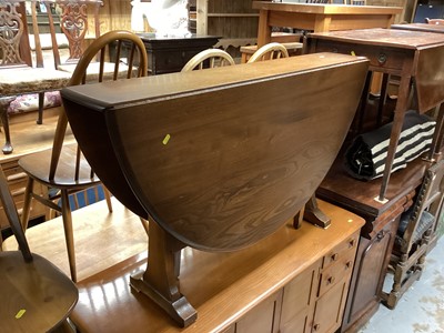 Lot 1266 - Ercol drop leaf table together with a set of four stick back chairs