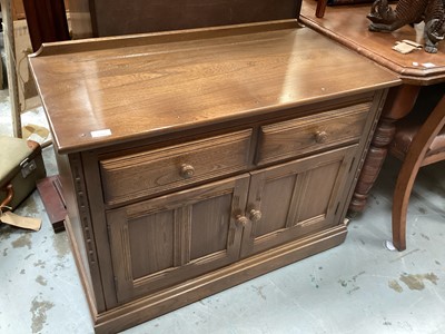 Lot 1280 - Ercol sideboard with two drawers and two panelled doors below