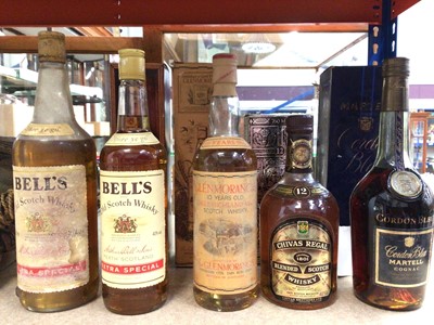 Lot 354 - Four bottles of whisky - two Bell's, Glenmorangie and Chivas Regal and a bottle of Martell Cordon Bleu cognac (5)