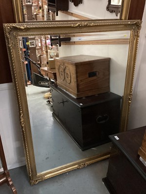 Lot 1200 - Large bevelled wall mirror in ornate gilt frame