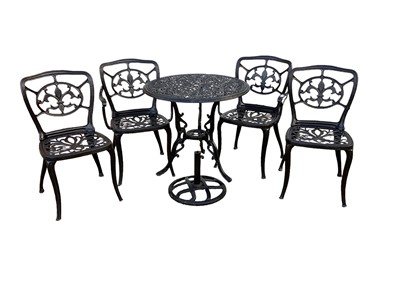 Lot 1206 - Wrought iron circular garden table and four matching chairs