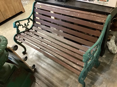 Lot 1213 - Cast iron and slatted wood garden bench, 126.5cm wide