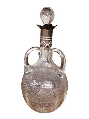 Lot 1006 - Edwardian glass decanter with three handles and a silver collar (London 1906)