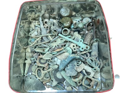 Lot 2489 - Tin containing metal detecting finds including a seal stamp