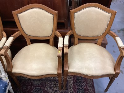 Lot 1237 - Set of four French style elbow chairs with studded beige upholstery