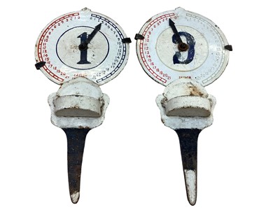 Lot 2487 - Two old enamel golf tee markers with tee pot/holders