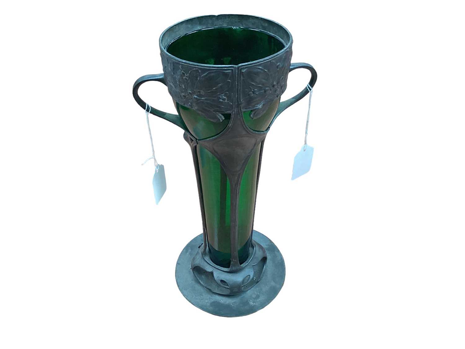 Lot 2505 - Art Nouveau pewter two handled vase with green glass liner