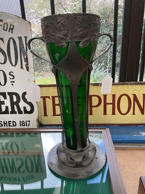 Lot 2505 - Art Nouveau pewter two handled vase with green glass liner