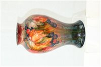 Lot 2115 - Moorcroft pottery flambé vase decorated in the...