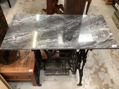 Lot 1259 - Treadle sewing machine base with marble top, 91cm wide, 45cm deep, 78.5cm high