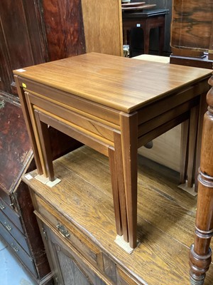 Lot 1261 - Nest of three teak occasional tables together with a small mahogany chest of four deep drawers (2)