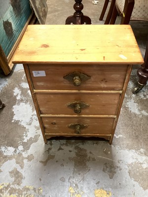 Lot 1264 - Pine bedside chest with single drawer and panelled door below, together with a small pine chest of three drawers, metal coal box and a wooden trunk with metal side handles (4)