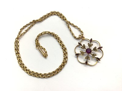 Lot 1022 - Edwardian amethyst and seed pearl floral pendant on 15ct gold chain with barrel clasp, 48.5cm long