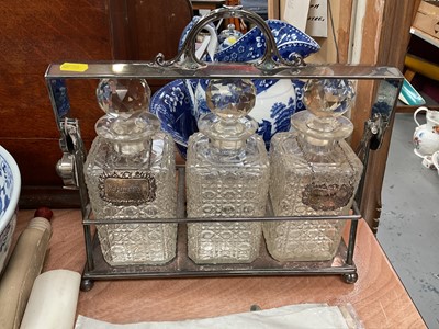 Lot 411 - Good quality three bottle tantalus in silver plated frame with two hallmarked silver whisky and sherry labels