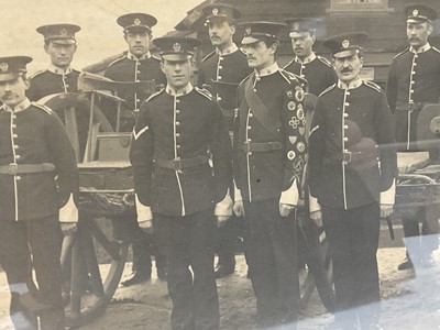 Lot 744 - Local interest- Framed photograph taken at Mistley, Essex, of the Volunteer Battalion Essex Regiment outside; Dod Parker's cottage with their Machine Gun Sergeant John Tipping.