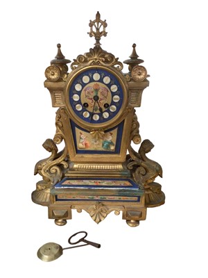 Lot 93 - French gilt metal and porcelain mounted mantel clock, with key and pendulum, 41cm high