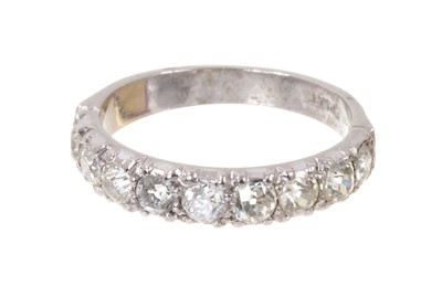 Lot 513 - Diamond eternity ring with a band of nine old cut diamonds