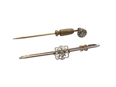 Lot 1067 - Victorian diamond cluster stick pin and an Edwardian diamond and seed pearl cluster bar brooch (2)