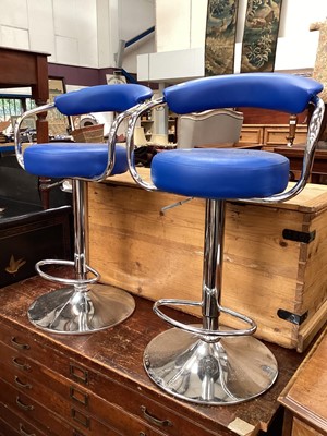 Lot 1307 - Pair of contemporary stainless steel revolving bar stools with blue seats