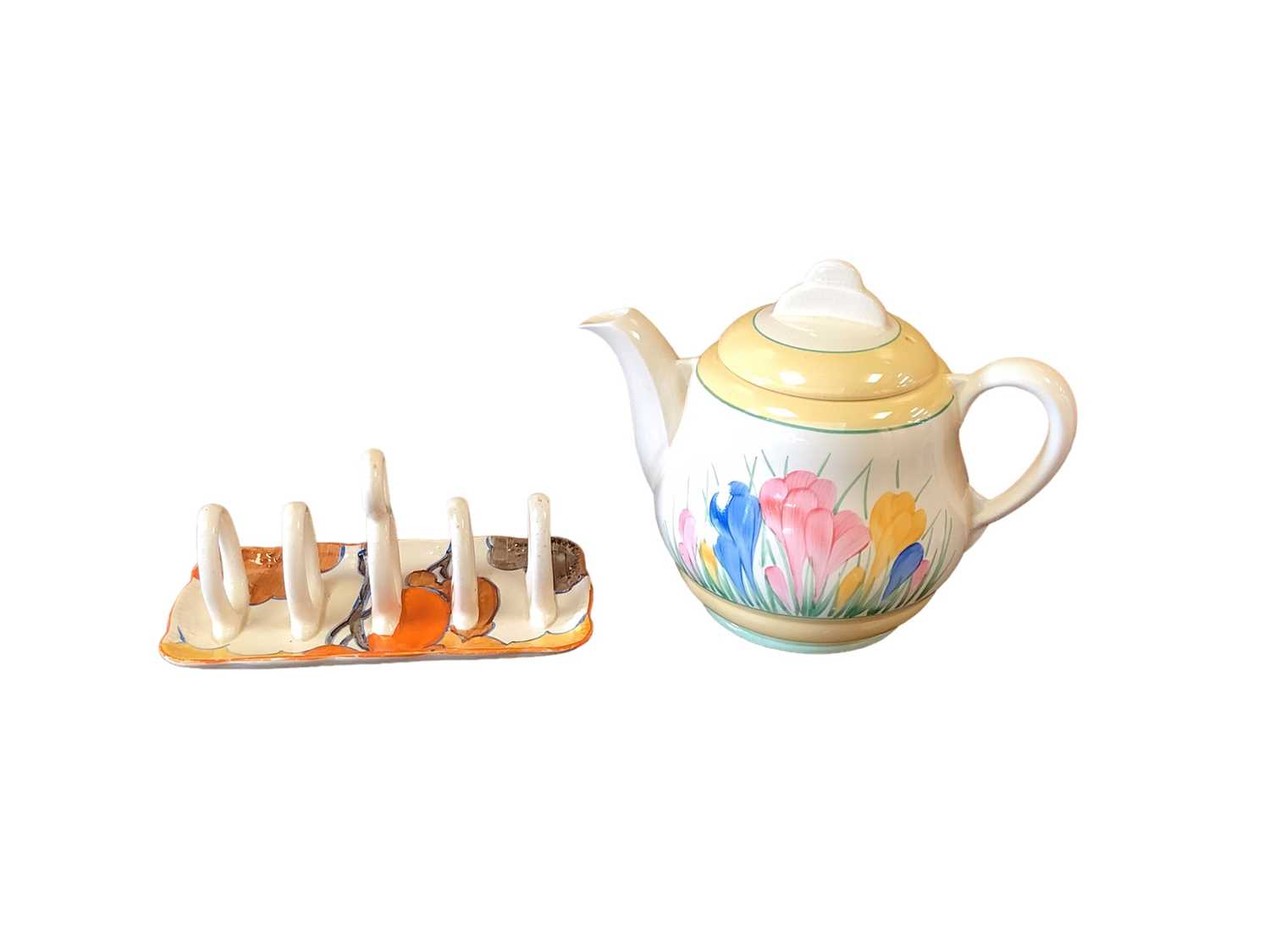 Lot 1200 - Clarice Cliff toast rack together with a teapot (2)