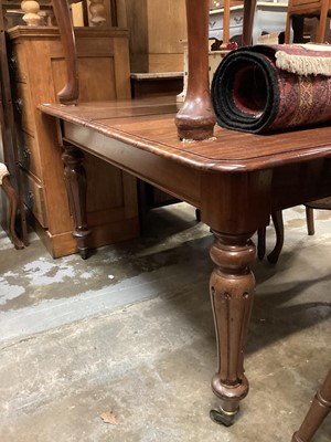 Lot 1334 - Victorian mahogany extending dining table with two extra leaves on fluted turend legs, 128cm x 114 without leaves, 1 leaf is 61.5cm wide the other is 48cm wide