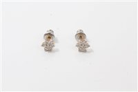 Lot 3243 - Pair of diamond flower-head cluster earrings