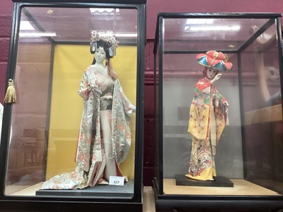 Lot 637 - Two Japanese costume figures in glazed cabinets