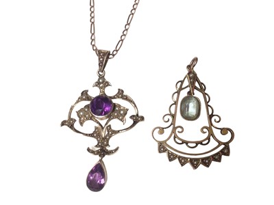 Lot 27 - Edwardian gold amethyst and seed pearl pendant necklace on chain together with an Edwardian gold and aquamarine and seed pearl pendant (2)