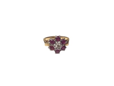Lot 28 - 18ct gold ruby and diamond flower head cluster ring