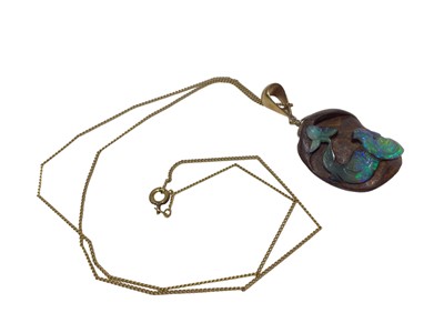 Lot 579 - Carved black opal pendant on chain