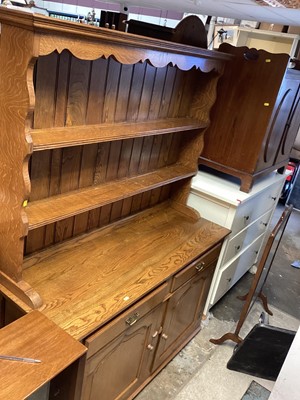 Lot 1387 - Oak two height dresser with shelves above, two drawers and two doors below, 128cm wide, 45cm deep, 172cm high