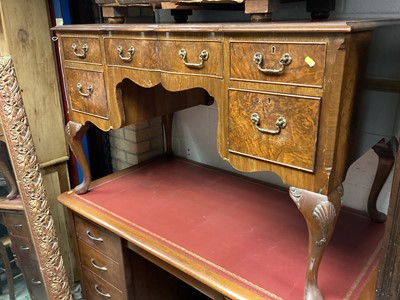 Lot 1398 - Georgian style walnut kneehole desk with inset leather lined top and five drawers below on carved cabriole legs, 122cm wide, 63.5cm deep, 76.5cm high