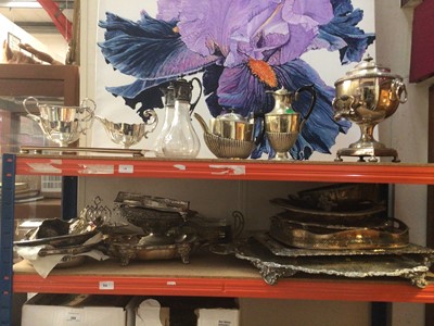 Lot 119 - Group of silver plate, including trays, an urn, claret jugs, etc (2 shelves)