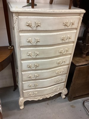 Lot 1417 - French style white painted serpentine fronted chest of seven drawers, 66cm wide, 48cm deep, 122.5cm high, together with two other painted items with cherub decoration