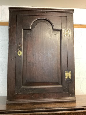 Lot 1420 - Antique oak corner cupboard with shelved interior enclosed by arched door