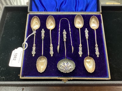 Lot 1082 - Set of six Victorian silver apostle teaspoons in a fitted case with sifter spoon and sugar tongs.