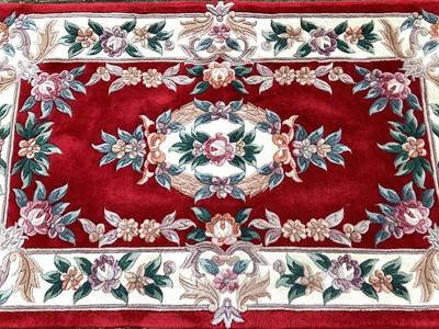 Lot 1434 - Chinese rug with floral decoration on red and cream ground, 158cm x 89cm, together with another, 160cm x 91cm