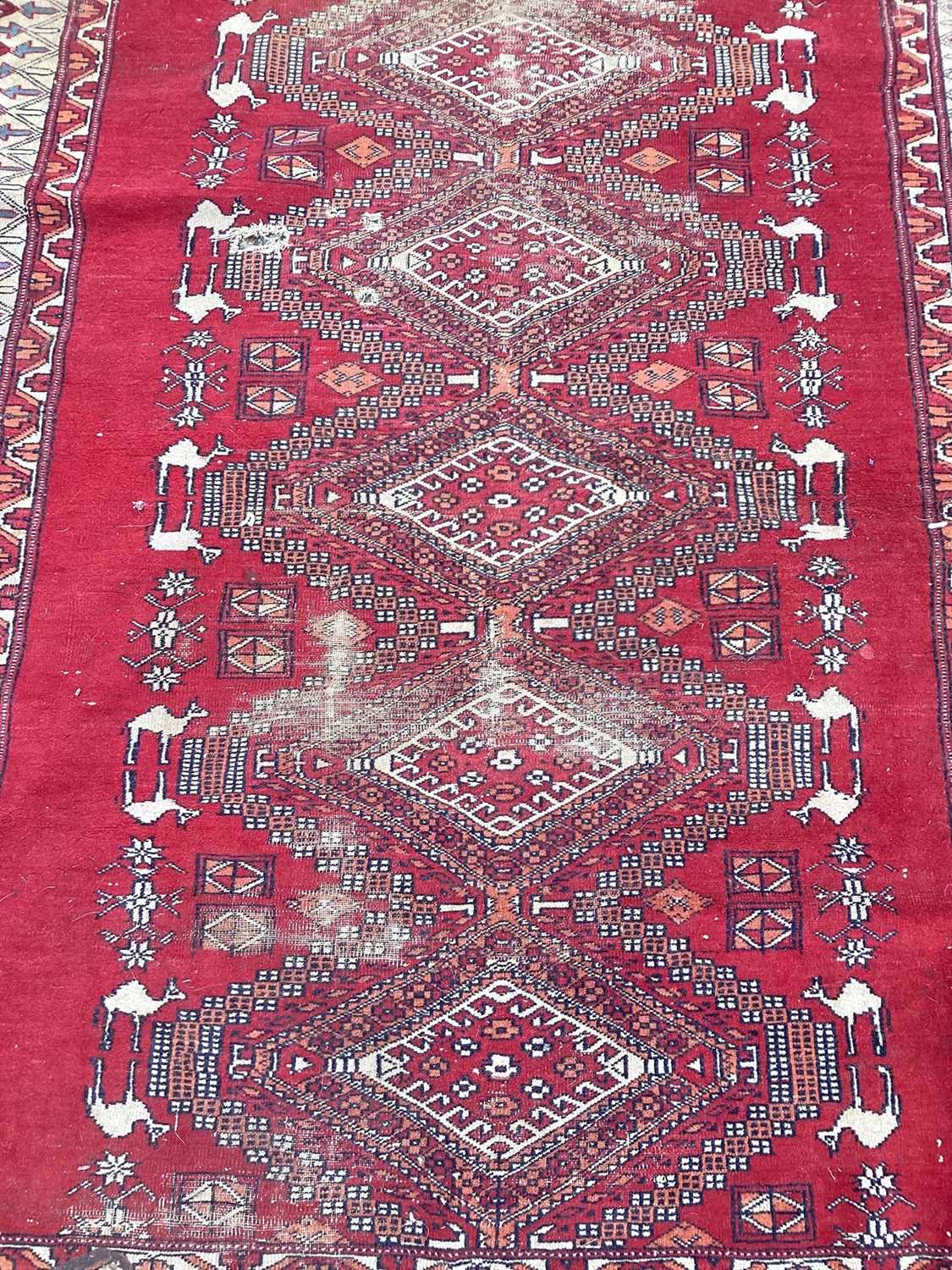 Lot 1439 - Eastern rug with six central medallions on red and cream ground, 167cm x 123cm