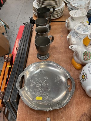 Lot 486 - Four Tudric pewter mugs, together with a German Art Nouveau pewter dish (5)