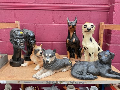 Lot 665 - Group of large dog ornaments together with two African heads.