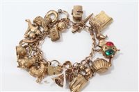 Lot 3209 - Gold (9ct) charm bracelet with quantity of...