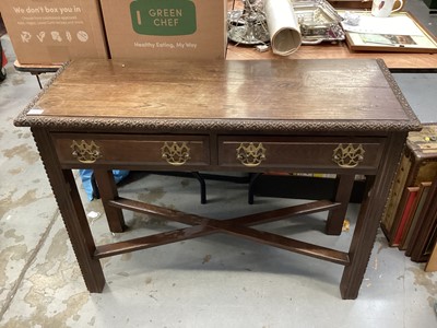 Lot 1476 - Early 20th century oak hall table with two drawers on square legs joined by x frame stretchers, 107cm wide, 40cm deep, 79.5cm high