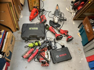 Lot 507 - Group of assorted power tools to include cordless battery grinder and reciprocating saw, drills and other items.