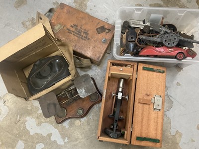 Lot 252 - Set of Victorian postal scales with weights, WWII gas mask, WWII G.G.S. Recorder MKII, student microscope, and a collection of vintage toys to include tinplate clockwork cars, lead soldiers etc