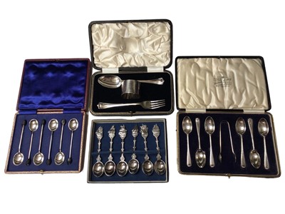Lot 32 - Set of six silver bean end coffee spoons, set of six silver teaspoons and pair of sugar tongs, silver tablespoon, fork and napkin set