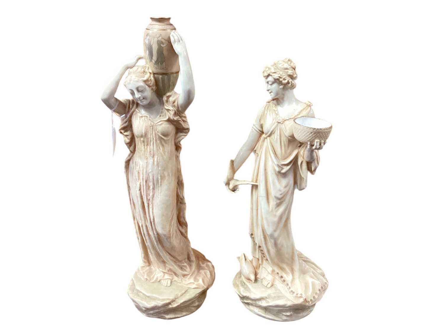Lot 1149 - Pair of Royal Doulton Burslem figures of female water carriers