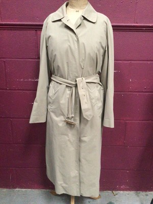 Lot 2088 - Vintage Aquascutum women's beige trench coat with check lining.